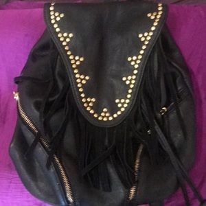Black back pack with black fringe and gold detail